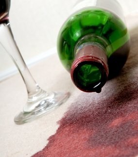 red wine stained carpet in holiday home